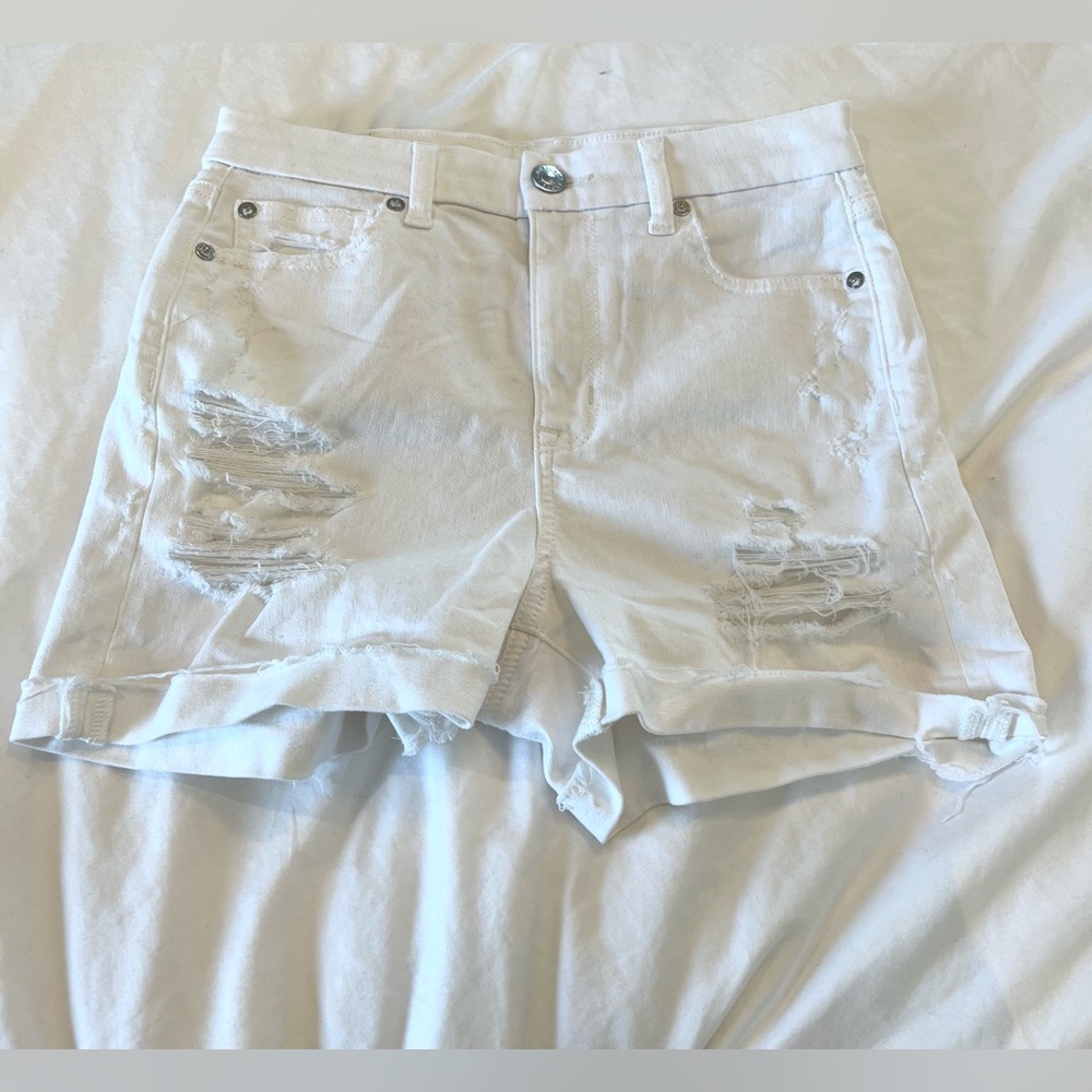 White ripped high rise American Eagle shorts.